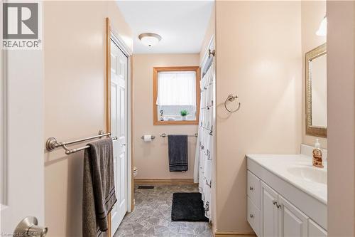 Bathroom with stone floors, vanity, and a shower with curtain - 230 Saugeen Street, Grey Highlands, ON - Indoor Photo Showing Bathroom