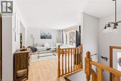 Living area featuring wood finished floors - 