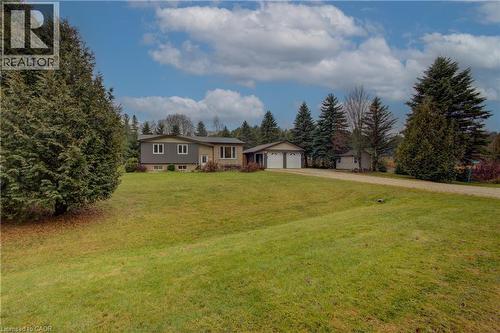 Split level home featuring a garage, a front lawn, and driveway - 230 Saugeen Street, Grey Highlands, ON - Outdoor