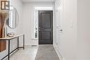 Foyer entrance featuring baseboards and light tile patterned floors - 5056 New Street Unit# 21, Burlington, ON  - Indoor 