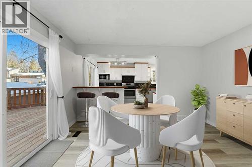 The breakfast nook has a sliding glass door overlooking the expansive private backyard - 4 Pardue Close, Red Deer, AB - Indoor Photo Showing Dining Room