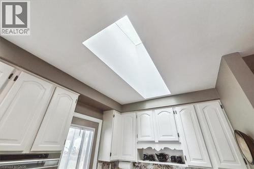 Kitchen view of a skylight and white cabinets - 359 Pepper Drive, Burlington, ON -  Photo Showing Other Room