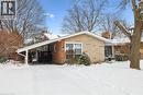 Snow covered property featuring a chimney and brick siding - 359 Pepper Drive, Burlington, ON  - Outdoor 