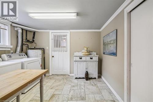 Washroom featuring separate washer and dryer and baseboards - 359 Pepper Drive, Burlington, ON - Indoor Photo Showing Laundry Room