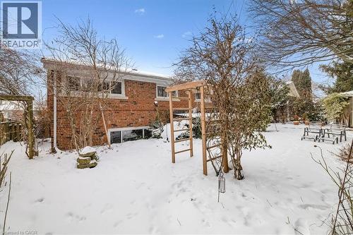 Snow covered back of property with brick siding - 359 Pepper Drive, Burlington, ON - Outdoor