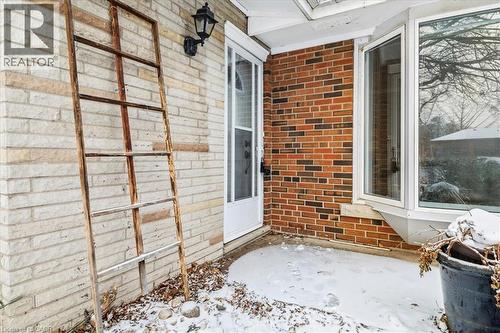 View of exterior entry featuring brick siding and a patio - 359 Pepper Drive, Burlington, ON - Outdoor With Exterior