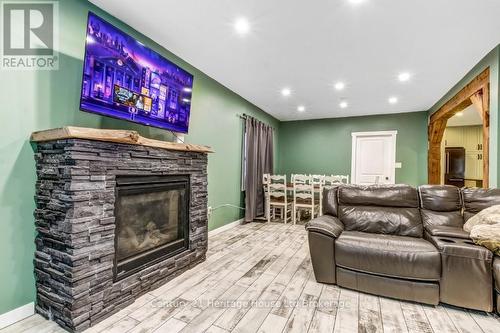 87 Bay Street, Woodstock (Woodstock - South), ON - Indoor Photo Showing Living Room With Fireplace