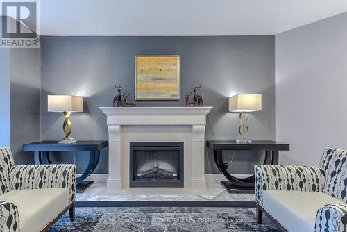 406 - 100 Observatory Lane, Richmond Hill, ON - Indoor Photo Showing Living Room With Fireplace