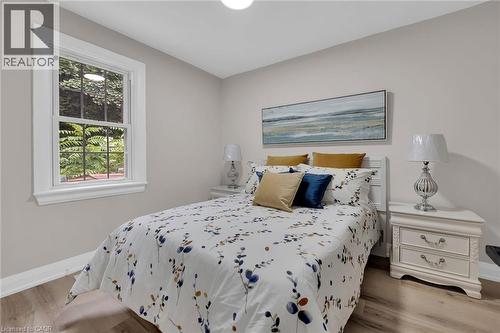 Bedroom featuring baseboards and wood finished floors - 174 East 34Th Street, Hamilton, ON - Indoor Photo Showing Bedroom