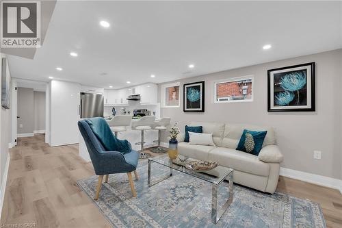 Living area with light wood-style flooring and recessed lighting - 174 East 34Th Street, Hamilton, ON - Indoor Photo Showing Living Room
