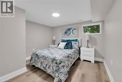Bedroom with light wood finished floors - 