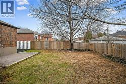 Fenced backyard featuring a patio and a residential view - 