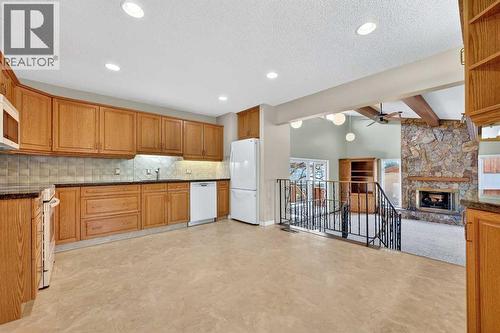 5315 Valiant Drive Nw, Calgary, AB - Indoor Photo Showing Kitchen With Fireplace