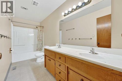 Main Floor Bathroom with Double Sinks - 5315 Valiant Drive Nw, Calgary, AB - Indoor Photo Showing Bathroom