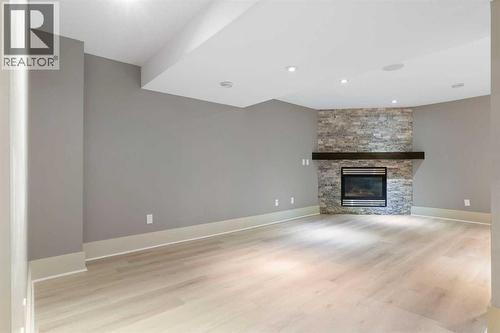 4711 Norquay Drive Nw, Calgary, AB - Indoor Photo Showing Living Room With Fireplace