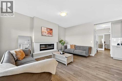 77 Belvedere Drive Se, Calgary, AB - Indoor Photo Showing Living Room With Fireplace