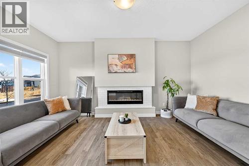 77 Belvedere Drive Se, Calgary, AB - Indoor Photo Showing Living Room With Fireplace