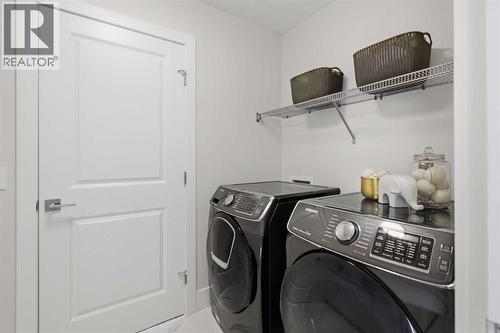 67 Aspen Vista Way Sw, Calgary, AB - Indoor Photo Showing Laundry Room