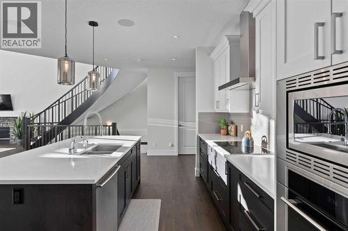 67 Aspen Vista Way Sw, Calgary, AB - Indoor Photo Showing Kitchen With Double Sink With Upgraded Kitchen