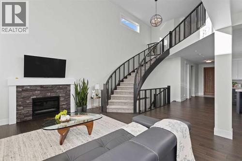 67 Aspen Vista Way Sw, Calgary, AB - Indoor Photo Showing Living Room With Fireplace
