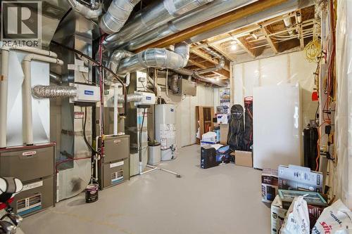 67 Aspen Vista Way Sw, Calgary, AB - Indoor Photo Showing Basement