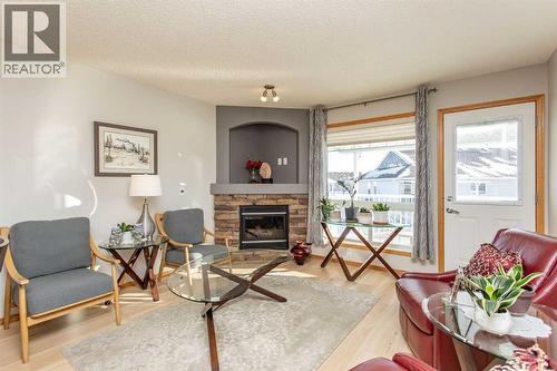 409 Jenkins Drive, Red Deer, AB - Indoor Photo Showing Living Room With Fireplace