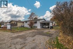 Freshly painted exterior and plenty of parking space with room for multiple vehicles. - 