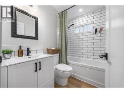Nicely updated 3-piece bath with clean finishes and bright lighting. - 