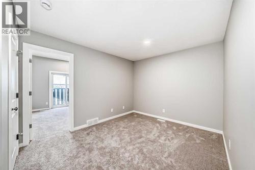 PLEASE NOTE: Photos are of a DIFFERENT Spec Home of the same model – fit and finish may differ. Interior selections and floorplans shown in photos - 85 Starling Boulevard Nw, Calgary, AB - Indoor Photo Showing Other Room