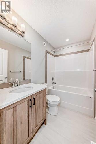 PLEASE NOTE: Photos are of a DIFFERENT Spec Home of the same model – fit and finish may differ. Interior selections and floorplans shown in photos - 85 Starling Boulevard Nw, Calgary, AB - Indoor Photo Showing Bathroom