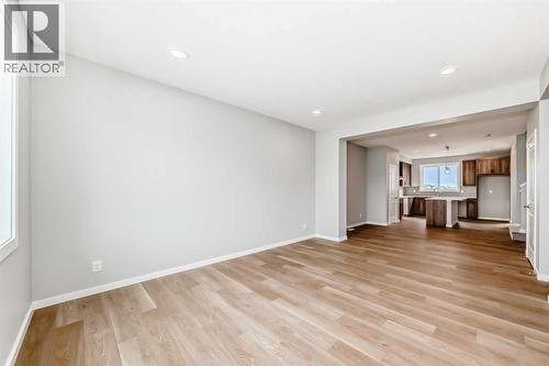 PLEASE NOTE: Photos are of a DIFFERENT Spec Home of the same model – fit and finish may differ. Interior selections and floorplans shown in photos - 85 Starling Boulevard Nw, Calgary, AB - Indoor Photo Showing Other Room