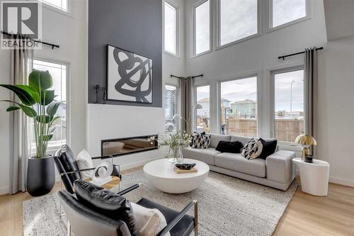 401 Sora Way Se, Calgary, AB - Indoor Photo Showing Living Room With Fireplace