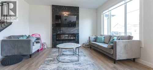 200 Lewiston Drive Ne, Calgary, AB - Indoor Photo Showing Living Room With Fireplace