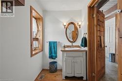 Half bathroom featuring vanity and light wood-type flooring - 