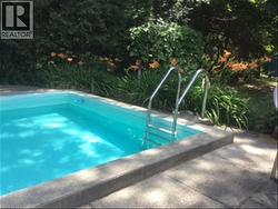 View of swimming pool with a patio area - 