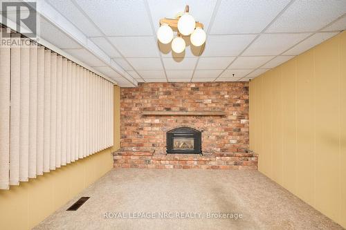 main floor family room with gas fireplace - 8 La Salle Drive, St. Catharines (Vine/Linwell), ON - Indoor With Fireplace