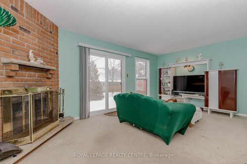 13-2655 Gananoque Drive, Mississauga, ON - Indoor Photo Showing Living Room With Fireplace