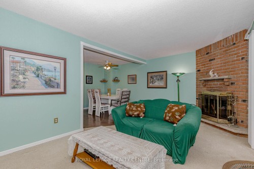 13-2655 Gananoque Drive, Mississauga, ON - Indoor Photo Showing Living Room With Fireplace
