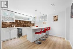 A wet bar in the basement that can easily be converted into a full kitchen.. - 