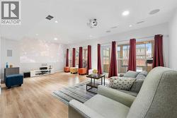 A spacious recreation room that can easily be divided to create an additional bedroom in the basement.. - 