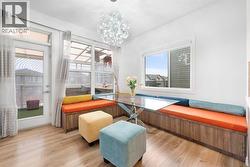 A dining area filled with natural light.. - 