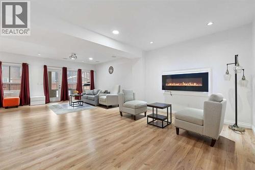 99 Evansglen Circle Nw, Calgary, AB - Indoor Photo Showing Living Room With Fireplace