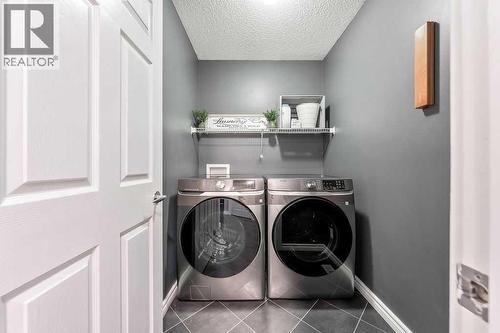 361 Cimarron Boulevard, Okotoks, AB - Indoor Photo Showing Laundry Room