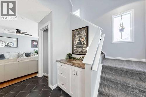 Main Floor Laundry Room - 361 Cimarron Boulevard, Okotoks, AB - Indoor Photo Showing Other Room