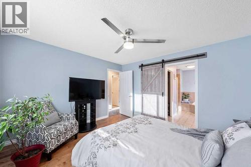 361 Cimarron Boulevard, Okotoks, AB - Indoor Photo Showing Bedroom
