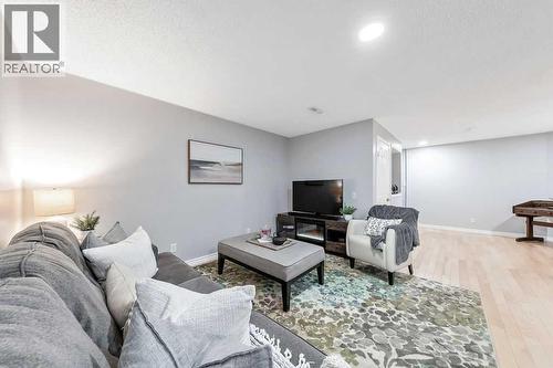 Lower-level family room - 361 Cimarron Boulevard, Okotoks, AB - Indoor Photo Showing Living Room