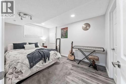 4th Lower level bedroom - 361 Cimarron Boulevard, Okotoks, AB - Indoor Photo Showing Bedroom
