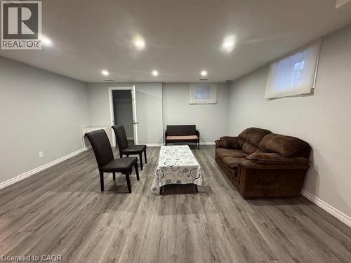 Living room with wood finished floors and baseboards - 509 St Moritz Avenue Unit# Lower, Waterloo, ON - Indoor Photo Showing Basement