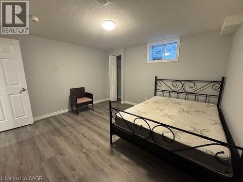 Bedroom featuring wood finished floors and a textured ceiling - 509 St Moritz Avenue Unit# Lower, Waterloo, ON - Indoor Photo Showing Bedroom