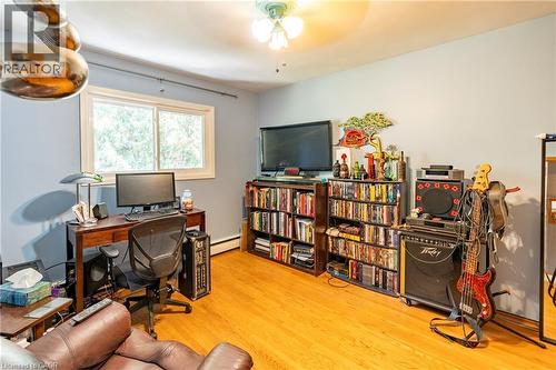 Office area with light wood-type flooring, ceiling fan, and a baseboard radiator - 62 Moore Avenue, Kitchener, ON - Indoor Photo Showing Office